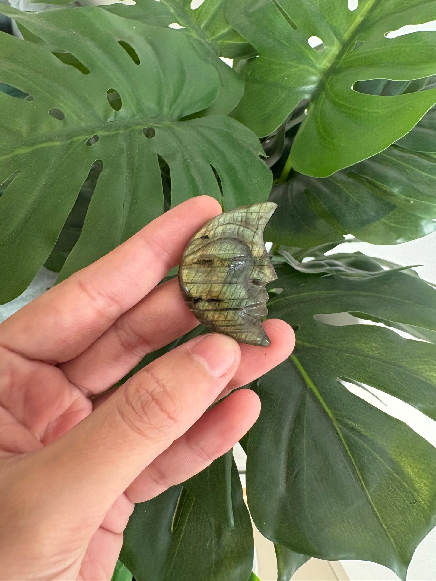 Moon face carved crystal