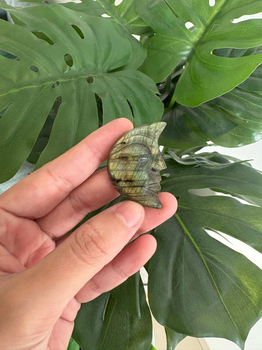 Moon face carved crystal