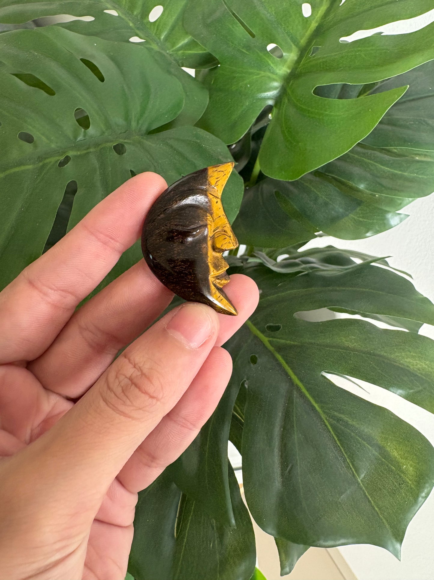 Moon face carved crystal