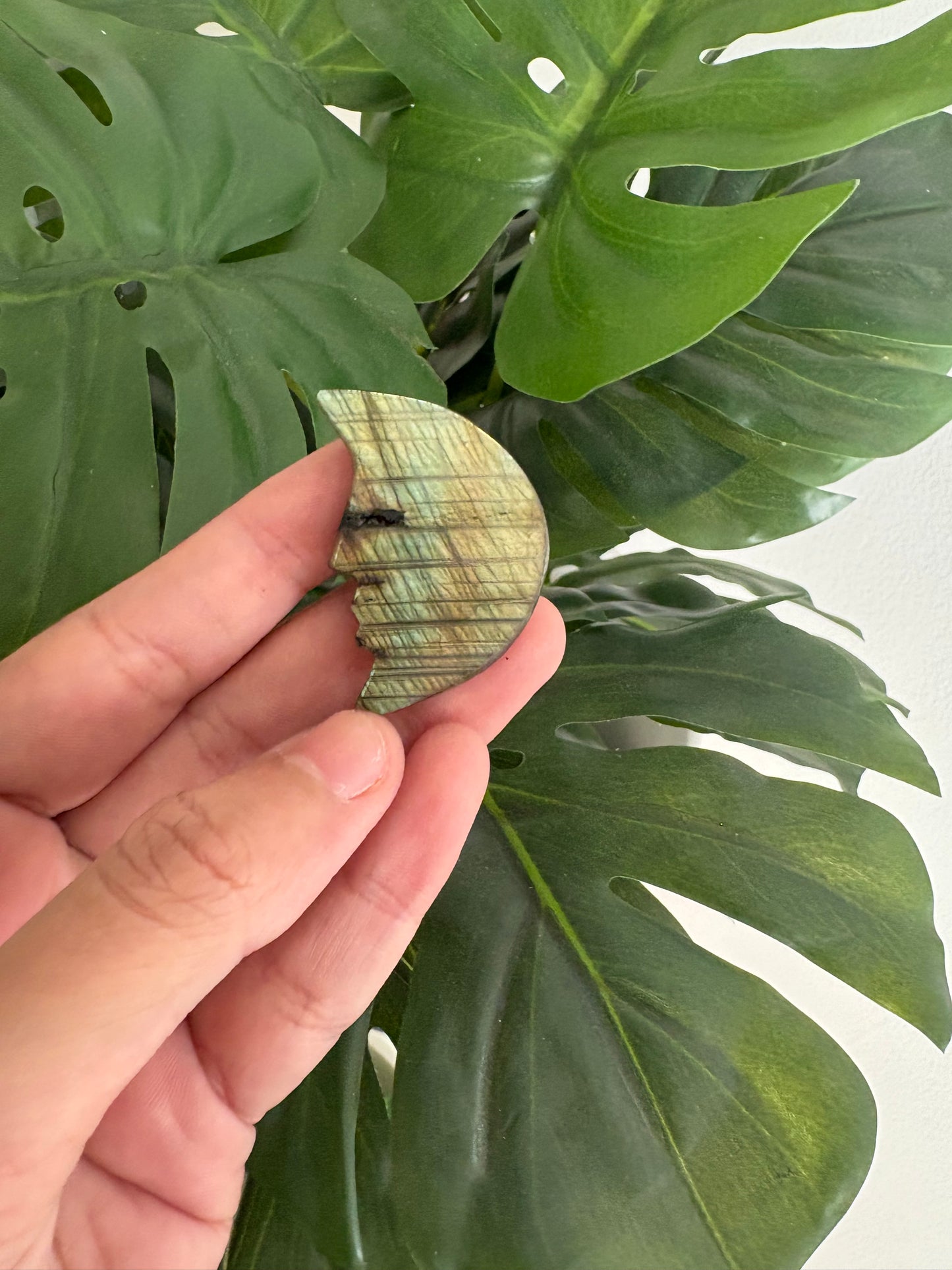 Moon face carved crystal